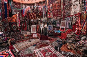 Tourst in Grand Bazaar Turkish Carpet Store