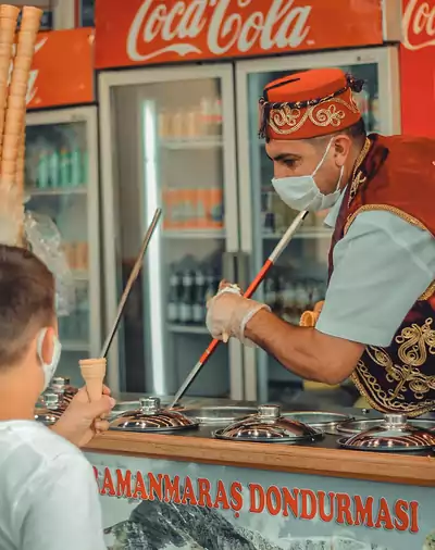 Turkish Icecream vendor wearing red Turkish Hat - ottoman Fez