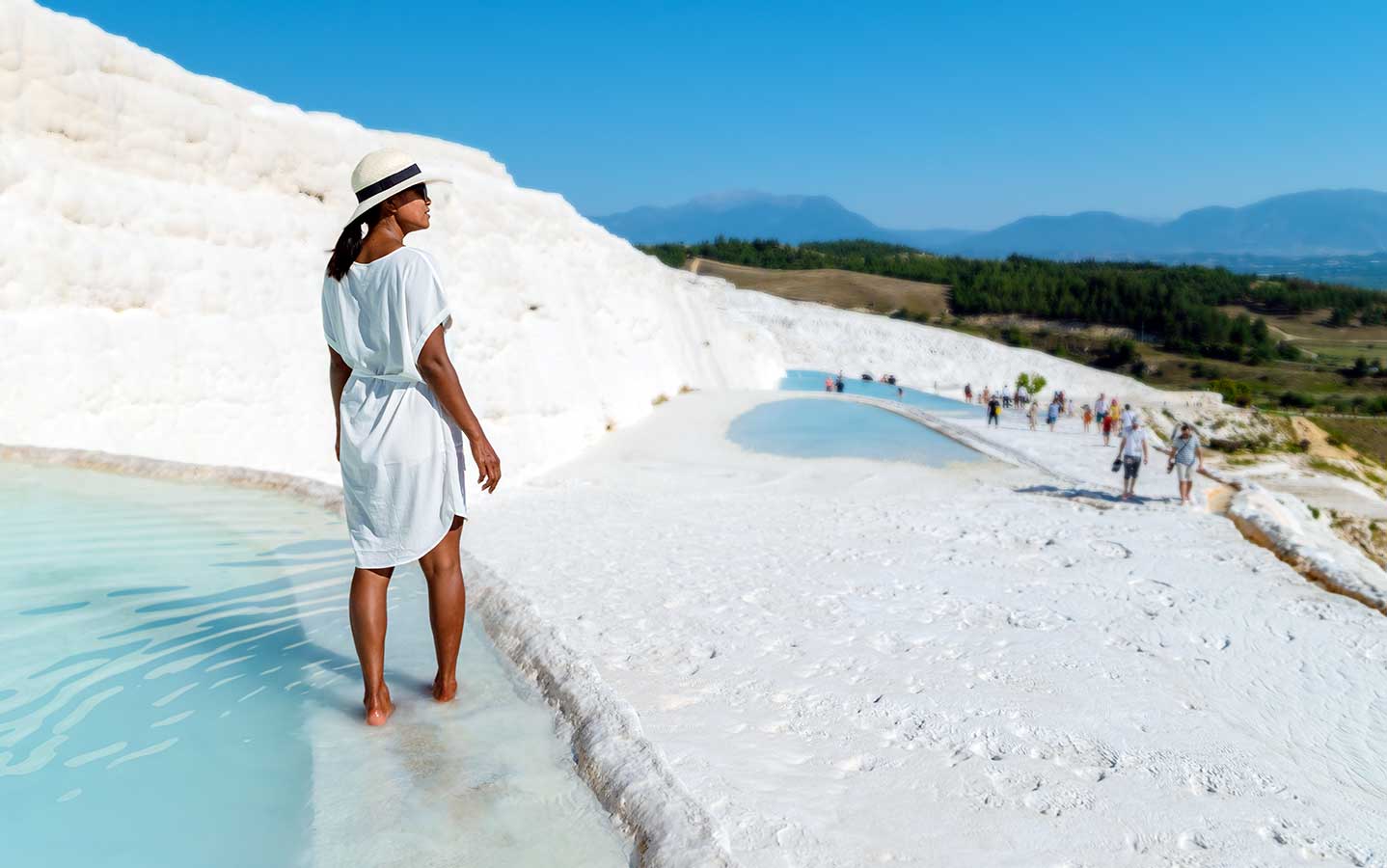 Woman in Natural travertine pools and terraces in Pamukkale